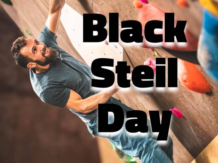 Ein Mann klettert an einer Wand mit der Überschrift Black Steil Day.