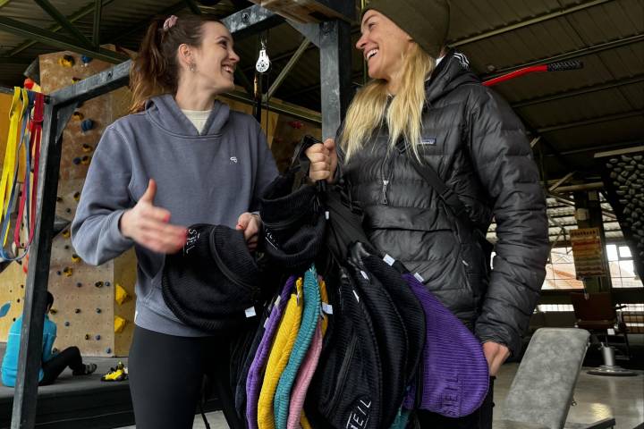 two women show the new colors of your steil fanny packs which are back in stock.
